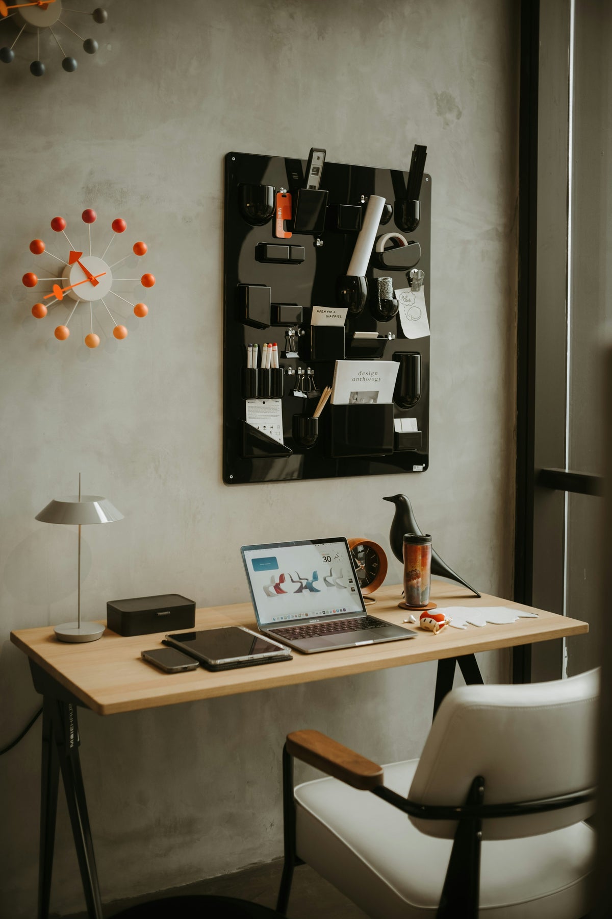 Modern organized workspace with laptop and neatly arranged desk