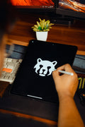 Designer creating a logo concept on a tablet