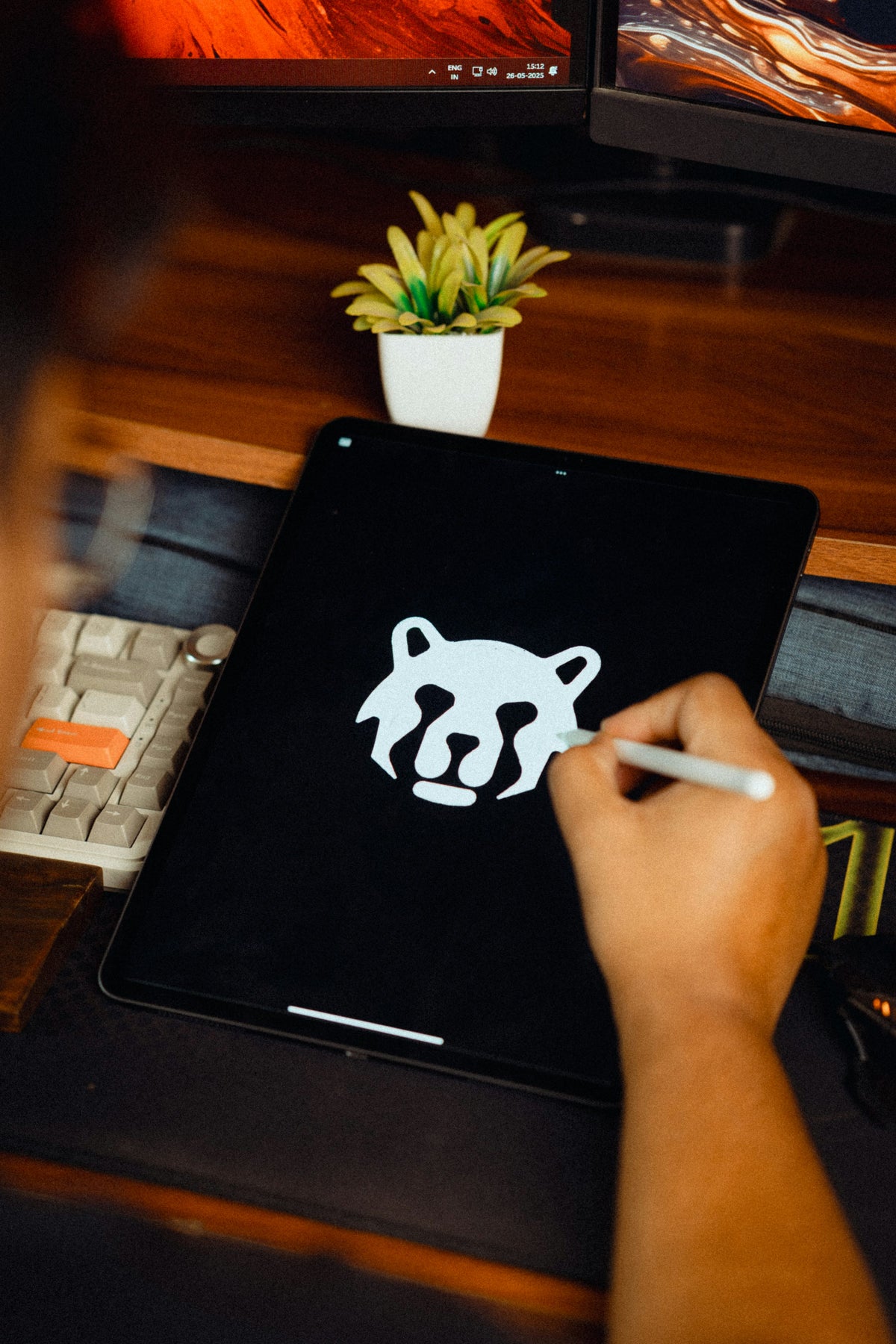 Designer creating a logo concept on a tablet