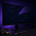 Curved monitor in a violet-lit studio showing a radar sweep chart beside a brass compass and pen