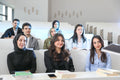 Students in a university lecture hall (photo via Pexels)